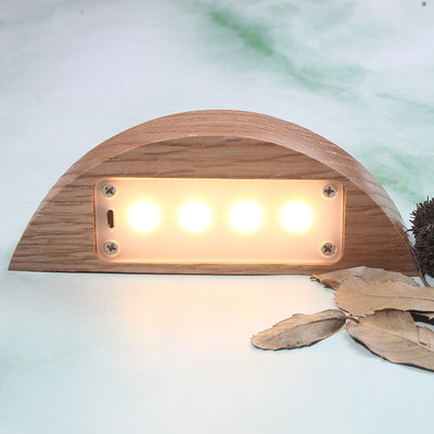 creative small night light gifts displayed on a surface with a natural wood finish and soft glowing lights