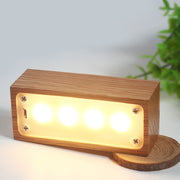 creative small night light gifts made of red oak log, glowing softly in a cozy setting.